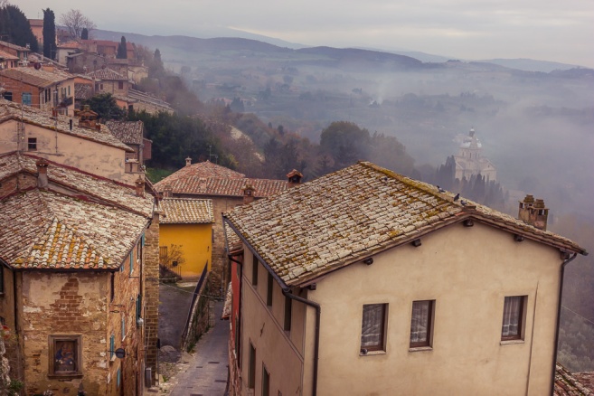 This is Montepulciano, Italy in late November. On a 12 day painting and photography trip, we faced many foggy mornings. Sometimes the fog didn't lift until afternoon. A local gave us a tip that we could escape the fog by going higher into the hill towns. I really love the contrast of the rough textured roofs against the soft somber background. The challenge with editing was to bring out the buildings without undoing the over-all softness of the scene.